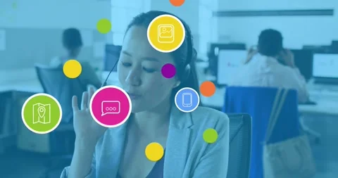 Animation of tech icons over asian woman in office having call Stock Footage 328709326
