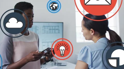 Animation of tech icons over happy diverse female coworkers talking in office Stock Footage 328006775
