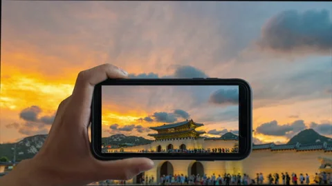Animation of Touchscreen Smart Phone record video on time lapse. at sunset Stock Footage 139843784