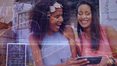 Animation of trading board and computer language over friends talking and using Stock Footage 327358461