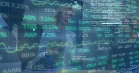 Animation of trading board, binary codes, computer language on diverse coworkers Stock Footage 330469443
