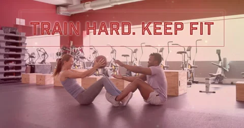 Animation of train hard keep fit text over diverse man and woman exercising in Stock Footage 310303332