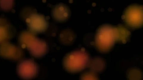 Animation of unfocused round orange elements appearing on a black background HD Stock Footage 123231033