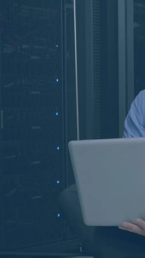 Animation of violet shapes and eye over stressed caucasian man working on laptop Stock Footage 344679518
