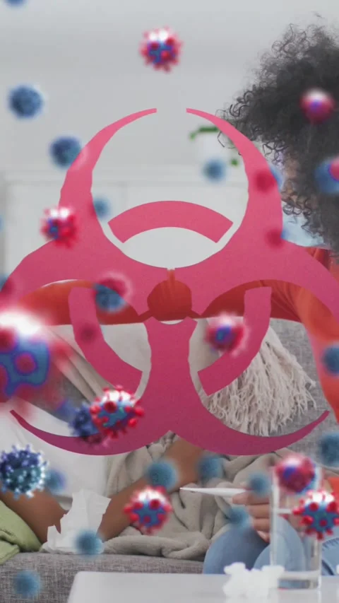 Animation of virus cells and biohazard symbol over african american mother with Stock-Footage 343503985
