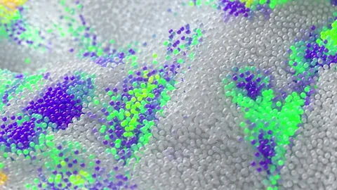Animation of white balls, particles that cause bright colored flashes. 4K Stock Footage 202606135