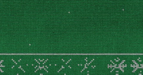 Animation of a white knitted snow on a green background stock video Stock Footage 164908024