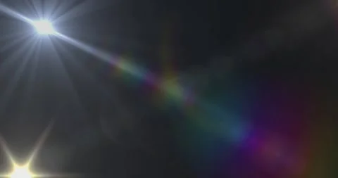 Animation of white light with beam and prismatic lens flare on dark background Stock Footage 329030427