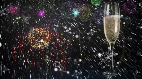 Animation of white particles over fireworks exploding and champagne glass Stock Footage 329361956