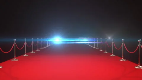 Animation of white spotlights and flashbulbs over empty red carpet runway and Stock Footage 260977111