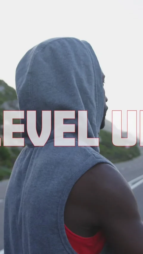 Animation of the words level up in white over man exercising on mountain road Stock Footage 320158913