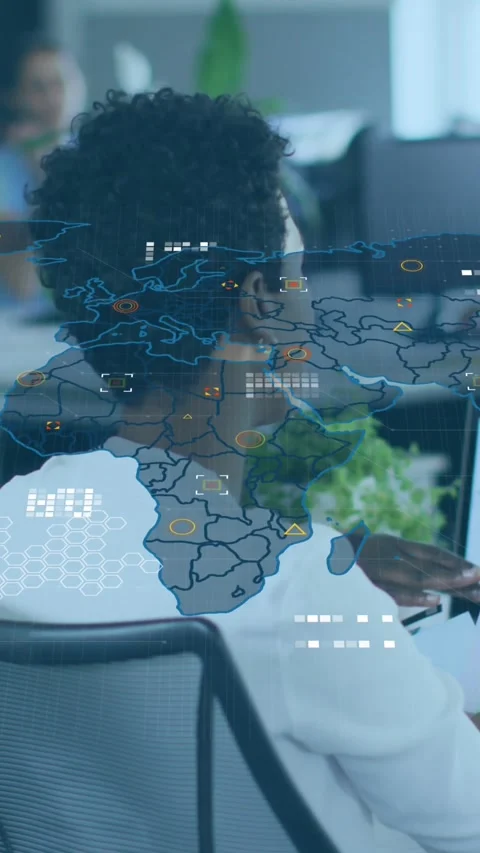 Animation of world map and icons over diverse female coworkers working in office Stock Footage 342915139