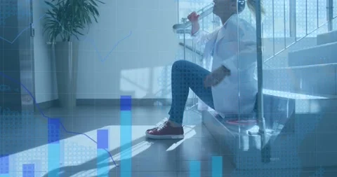Animation of world map and statistics over tired female doctor sitting on steps Stock Footage 166129801