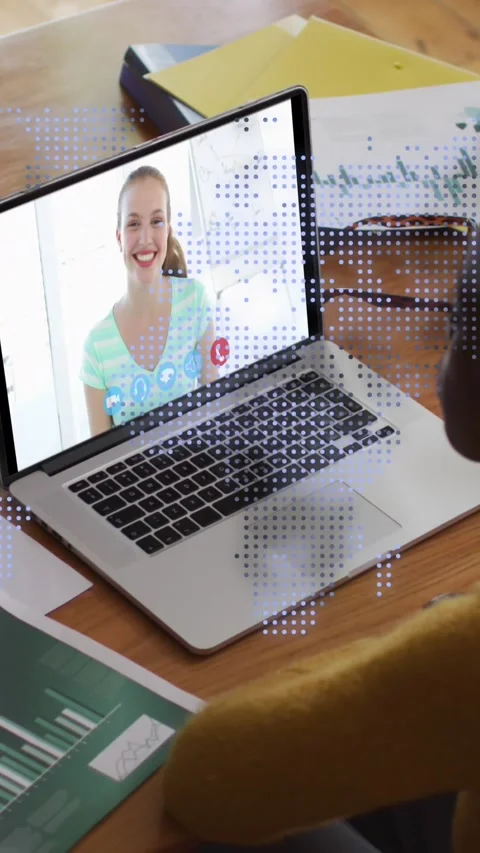 Animation of world map over african american woman having a video call on laptop Stock Footage 343738698