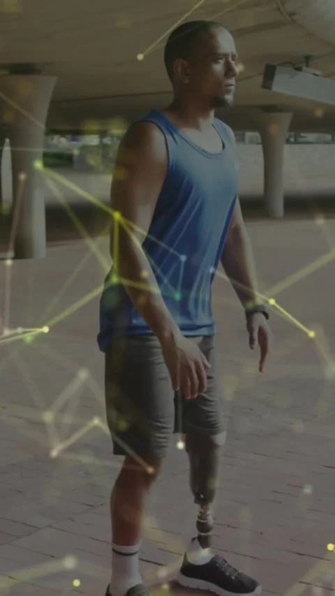 Animation of yellow communication network over male athlete with prosthetic leg Stock Footage 342225073