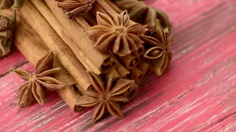 Anise and cinnamon, red background Stock Footage 47009618