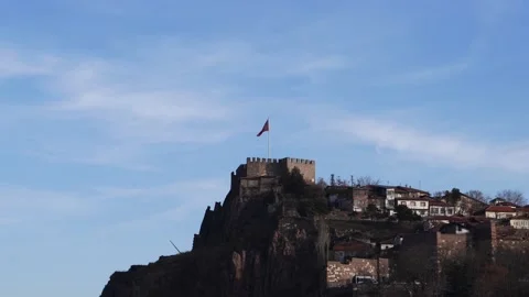 Ankara Castle on blue sky background with flying flag under moon Stock Footage 142899470