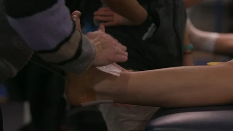 Ankle being taped 1 Stock Footage 106590686