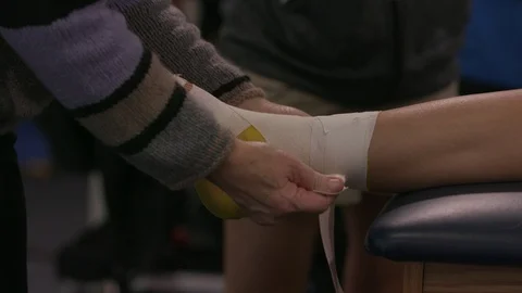 Ankle being taped 2 Stock Footage 106590671