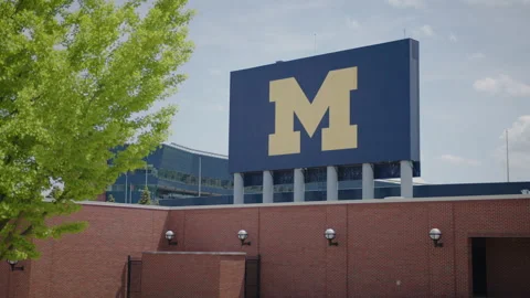 Ann Arbor, MI - May 27, 2022: University of Michigan logo at football stadium Stock Footage 200858492