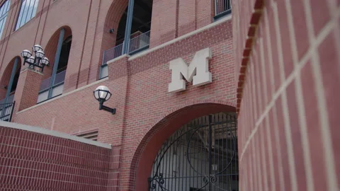 Ann Arbor, MI - May 27, 2022: University of Michigan M logo on campus building Stock Footage 200858954