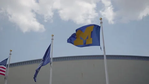 Ann Arbor, MI - May 27, 2022: University of Michigan logo on flag Stock Footage 200859328