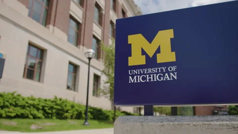 Ann Arbor, MI - May 27, 2022: University of Michigan logo at college campus Video stock 200860340