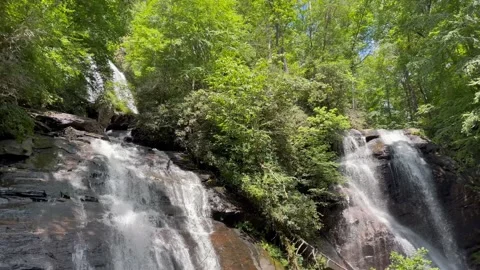 Anna Ruby Falls slow tilt up and down from twin waterfalls to stream Stock-Footage 206083427
