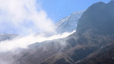 Annapurna mountain covered by clouds on a sunny day Stock Footage