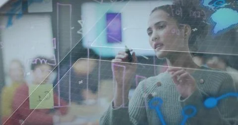 Annotating digital board grid while woman holding stylus and mapping data in Foto stock