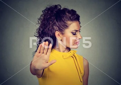 Annoyed angry woman with bad attitude giving talk to hand gesture Stock Photos