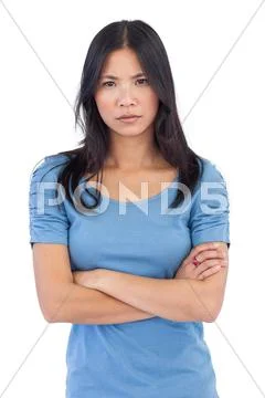 Annoyed asian woman with arms crossed Stock Photos