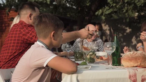 Annoyed boy on family dinner Stock Footage