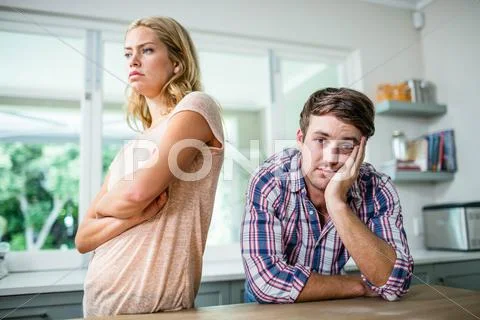 Annoyed couple ignoring each other Stock Photos