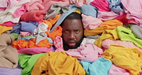 Annoyed dark skinned bearded man shouts loudly overwhelmed by domestic work Stock Footage 157335244