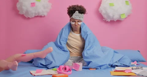 Annoyed displeased freelancer wrapped in soft duvet gestures angrily poses on Stock Footage 147991837