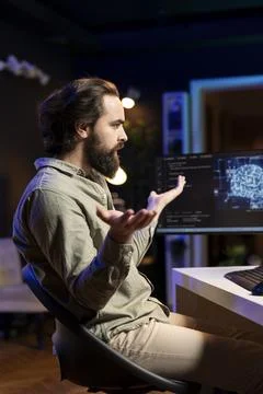 Annoyed engineer confused by error while using computer for AI computing 库存照片