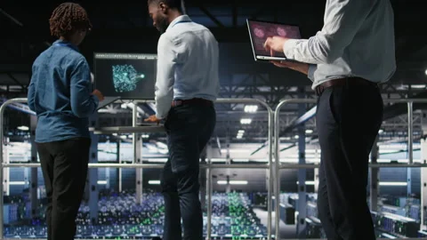 Annoyed engineer in data center reacting to critical error message on laptop Stock Footage 310276633