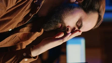 Annoyed IT admin rubbing temples in frustration after failing to remove bugs Stock Footage 265108376