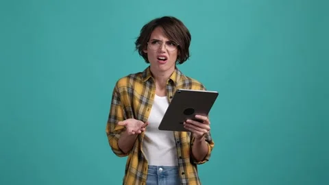 Annoyed lady use digital device wi fi problem isolated cyan color background Video stock 169629492