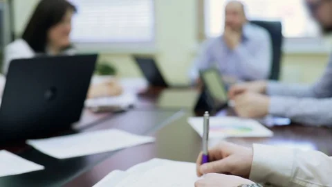 Annoyed man drumming pen on table, showing disagreement with colleagues opinion Stock Footage 76169405