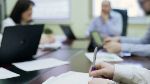 Annoyed man drumming pen on table, showing disagreement with colleagues opinion Stock Footage 76169955