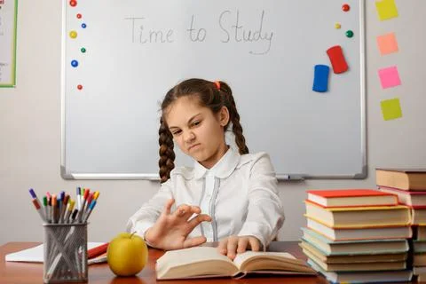 Annoyed pupil doesn't want to study Stock Photos
