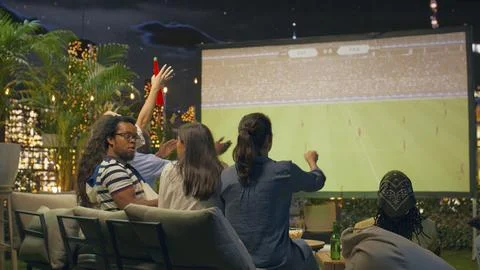 Annoyed spectators questioning referee decision during tense soccer match 写真素材