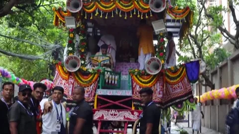 Annual Rath Yatra procession draws thousands of devotees in India's Kolkata, IND Stock Footage 339784917