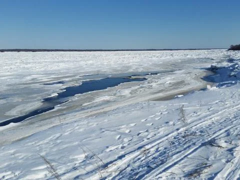 Anomalously cold spring. The river is covered with ice Stock Photos
