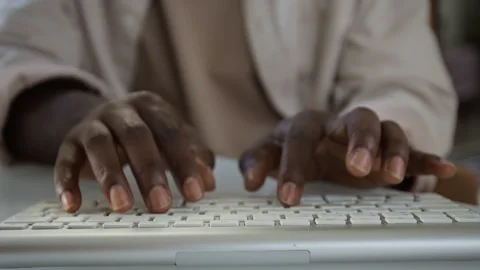 Anonymous Black Man Typing on Computer Keyboard Working at Office Desk Stock Footage 348153479