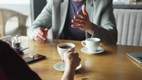 Anonymous businessmen talking in cafe Stock Footage 111756373