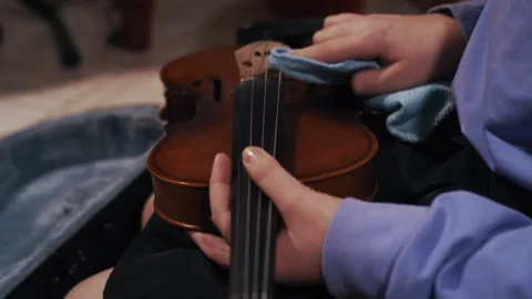 Anonymous Child Cleaning Violin Strings Stock-Footage 312042574