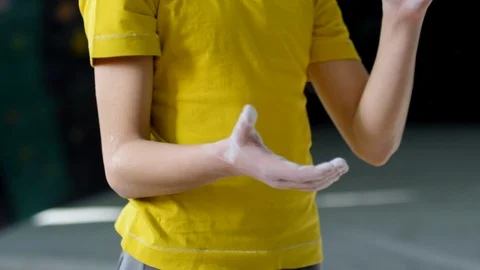 Anonymous Climber Clapping Hands and Loose Chalk Flying in Air Stock Footage 120108898